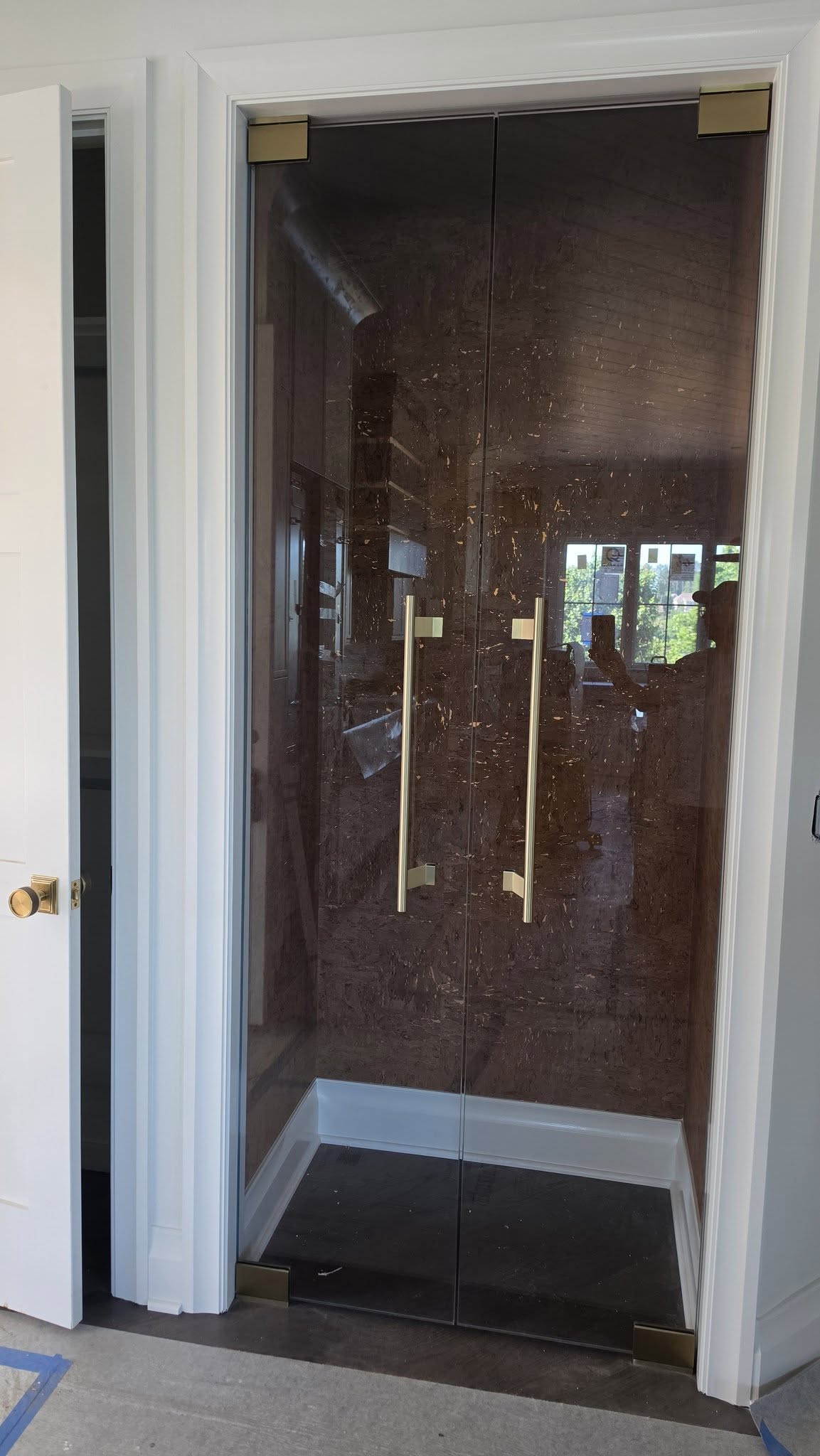 Wine Closet Using 1/2" Glass and Satin Brass Hardware